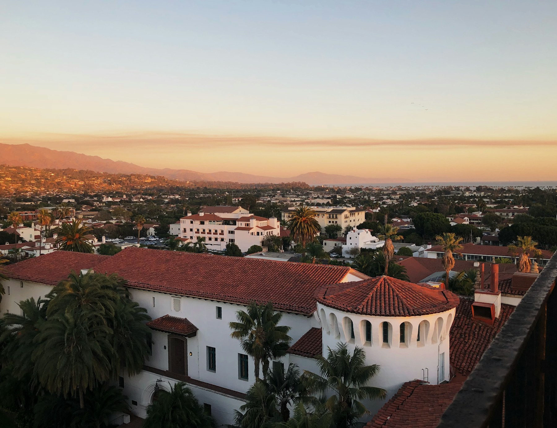 Sunset over Santa Barbara rooftops toward the ocean